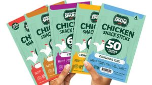 Exhibidor de punto de venta de Mighty Spark con snacks de pollo